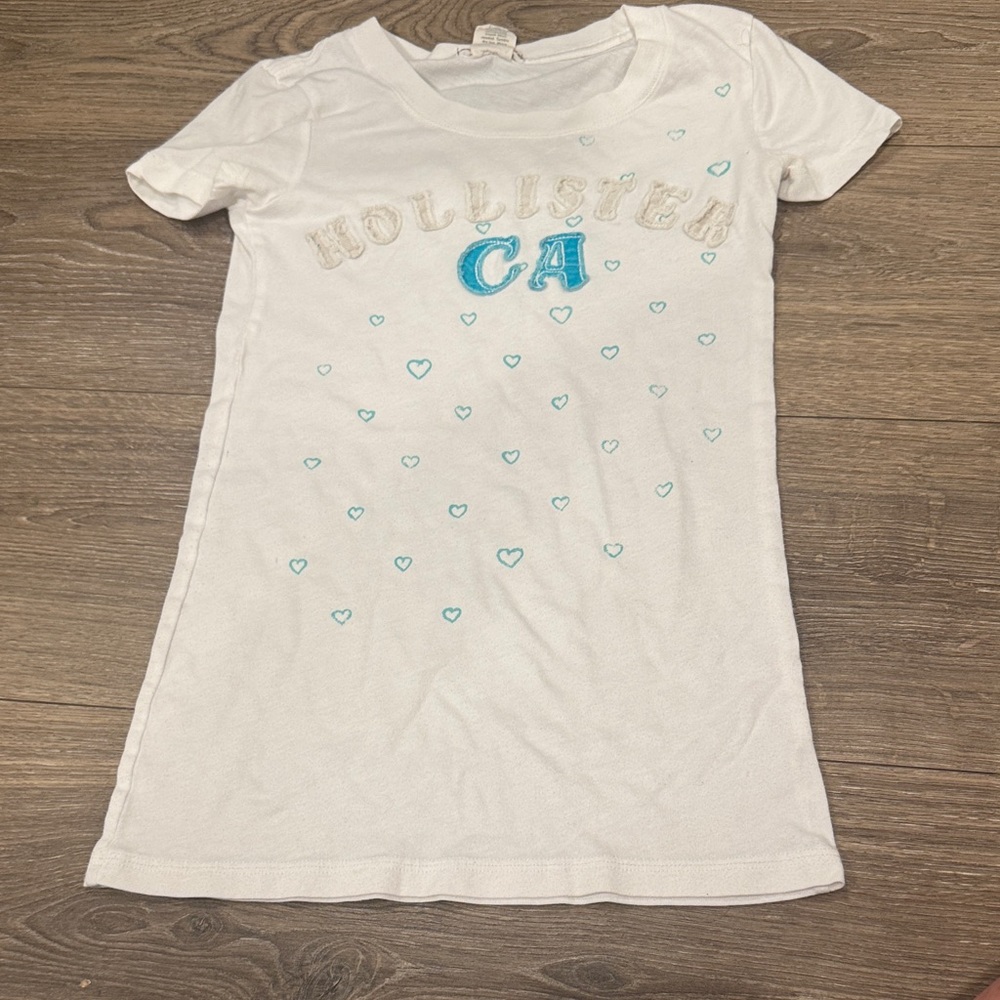 Hollister White Tee with Teal Heart Details